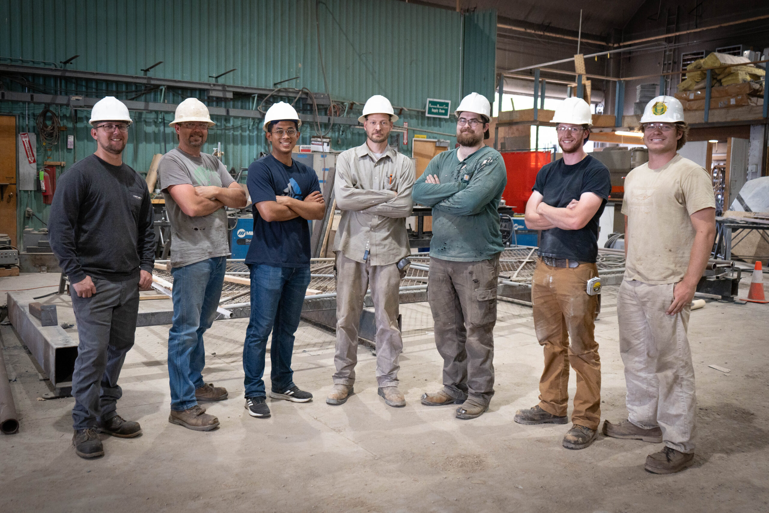 group of people folding arms and looking at the camera