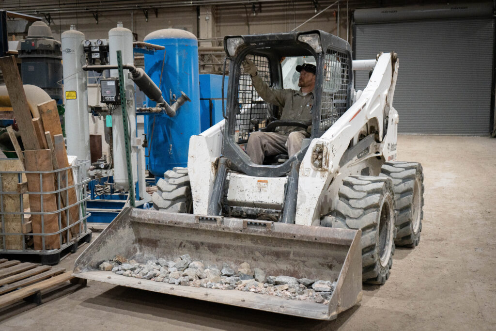 Bob cat with a person inside